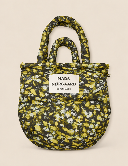Mads Nørgaard Light Ripstop Pillow AOP Bag in Flora AOP, an oversized floral puffer tote with padded handles and a lightweight recycled polyester design.